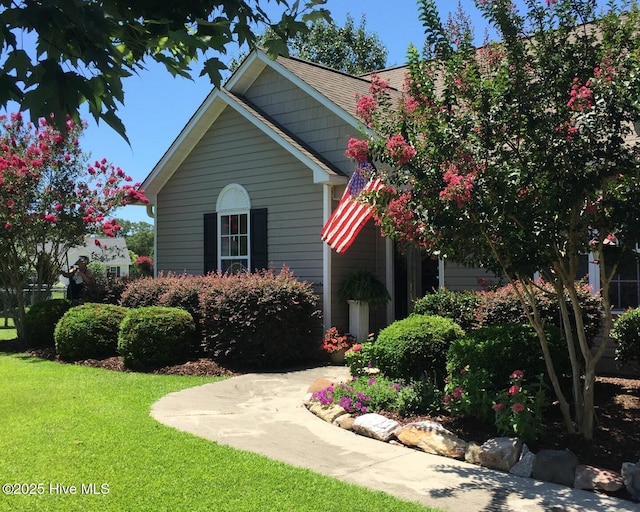 view of home's exterior with a lawn