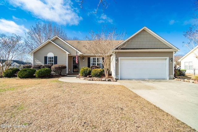 ranch-style home with a garage and a front lawn