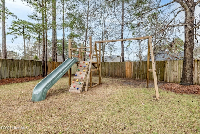 view of playground with a yard