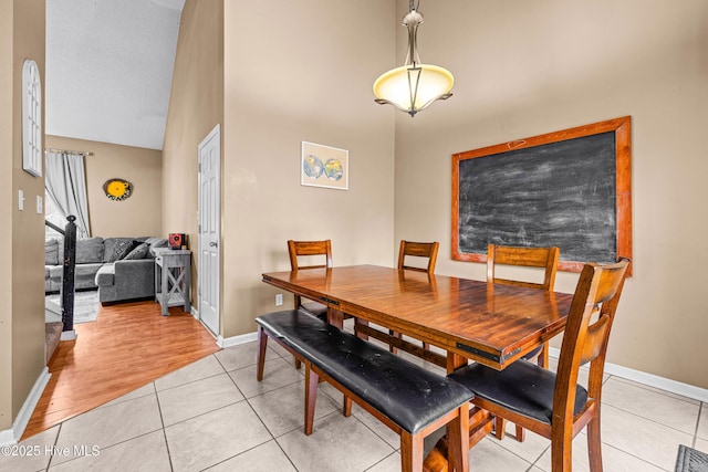 dining space with light tile patterned flooring