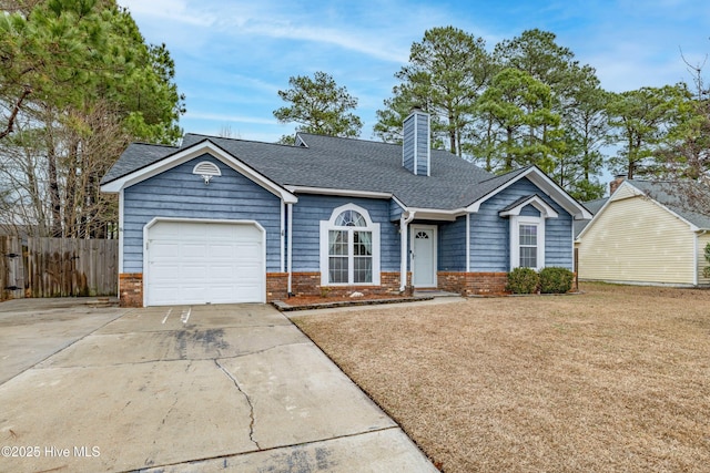 view of front facade with a garage and a front lawn