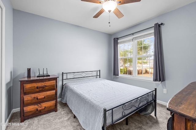 bedroom with light colored carpet and ceiling fan