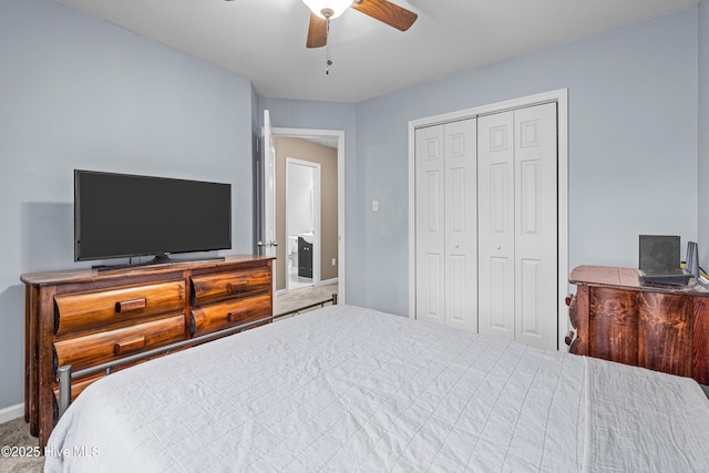 carpeted bedroom with ceiling fan and a closet