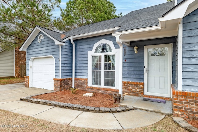 doorway to property featuring a garage