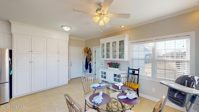 dining room featuring ornamental molding and ceiling fan