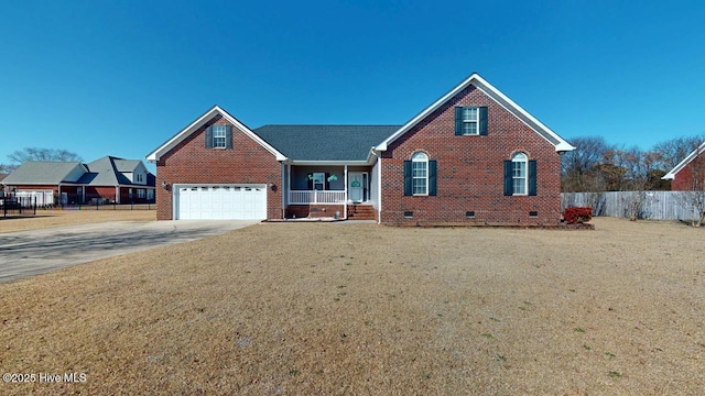 view of front of home featuring a garage, a front yard, and covered porch