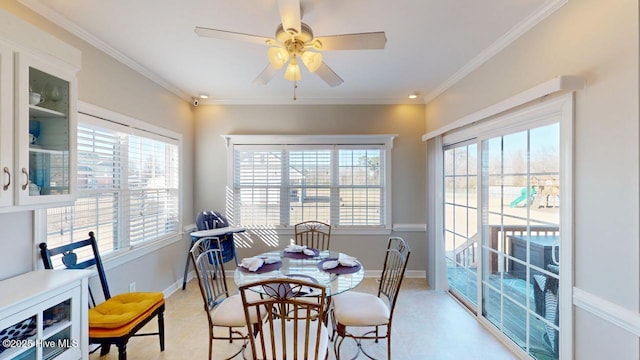 dining space featuring crown molding and ceiling fan