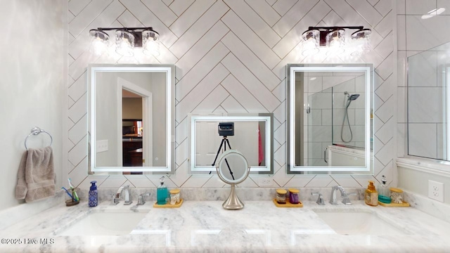 bathroom featuring walk in shower and vanity