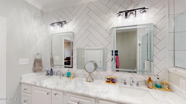 bathroom featuring vanity and ornamental molding