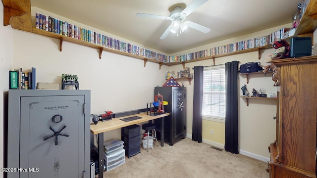 home office featuring ceiling fan and light colored carpet