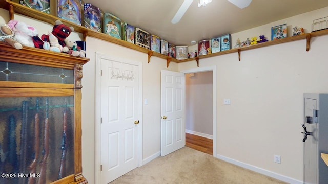 carpeted bedroom featuring ceiling fan