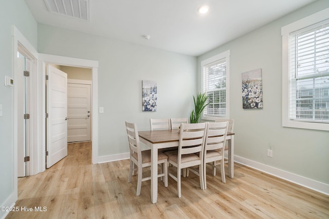 dining space featuring light hardwood / wood-style flooring