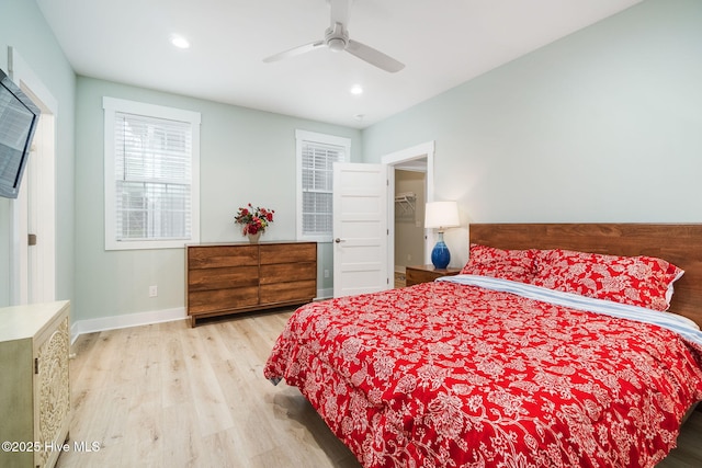 bedroom featuring light hardwood / wood-style floors and ceiling fan