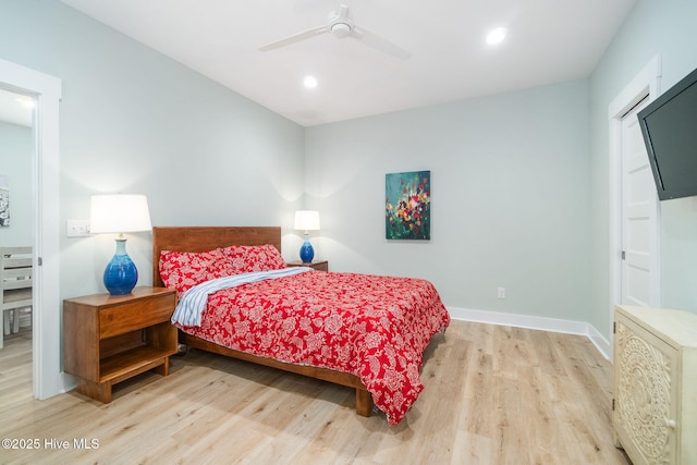 bedroom featuring ceiling fan and light wood-type flooring