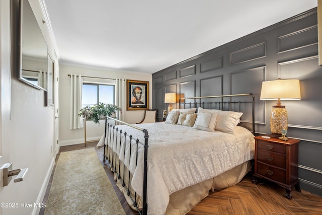 bedroom featuring parquet flooring and ornamental molding