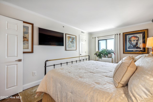 bedroom featuring crown molding