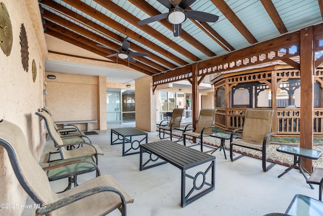 view of patio featuring ceiling fan