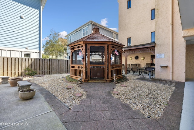 doorway to property with a patio area