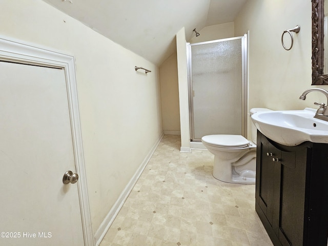 bathroom featuring a shower with door, vaulted ceiling, vanity, and toilet