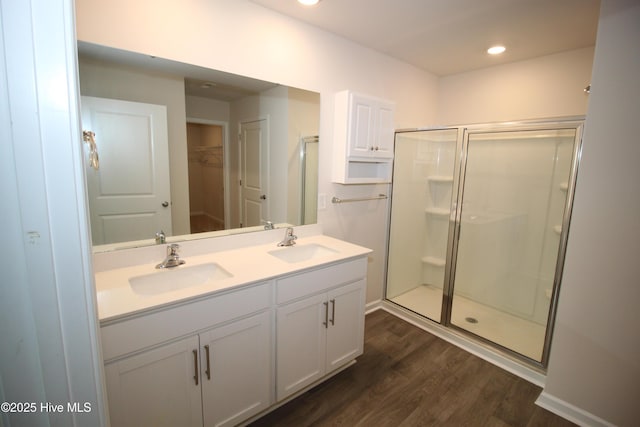 400 King Creek Dr, Havelock, NC 28532 - bathroom featuring wood finished floors, a sink, and a stall shower