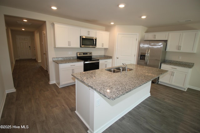 400 King Creek Dr, Havelock, NC 28532 - kitchen with a sink, dark wood finished floors, appliances with stainless steel finishes, and white cabinetry