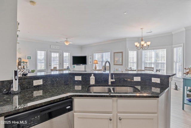 kitchen with sink, dark stone countertops, ornamental molding, dishwasher, and white cabinets