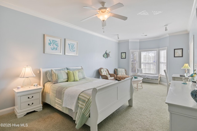 bedroom with crown molding, ceiling fan, and carpet flooring