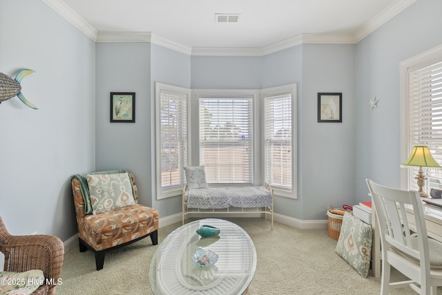 sitting room featuring crown molding and light carpet