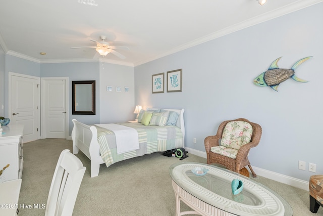 carpeted bedroom with ornamental molding and ceiling fan