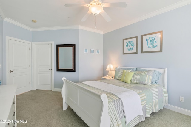 carpeted bedroom with crown molding and ceiling fan