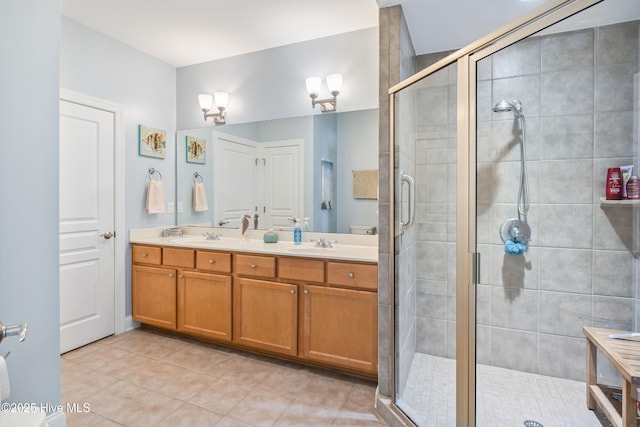 bathroom featuring vanity, tile patterned floors, and a shower with shower door