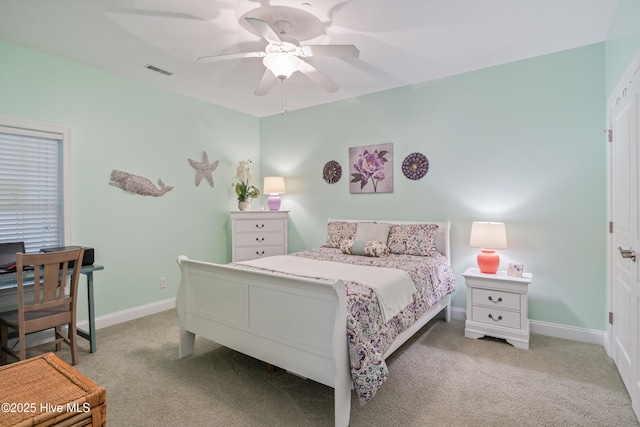 bedroom with light carpet and ceiling fan