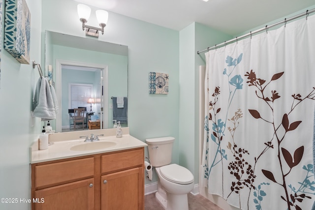 bathroom featuring vanity and toilet