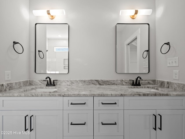 bathroom featuring double vanity and a sink