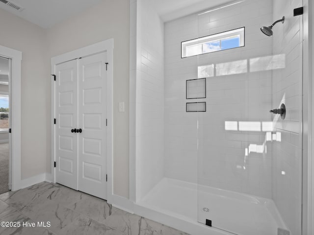 full bathroom featuring visible vents, baseboards, marble finish floor, and a stall shower