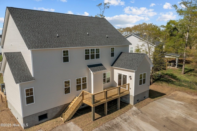 rear view of house featuring stairs, roof with shingles, crawl space, and a wooden deck