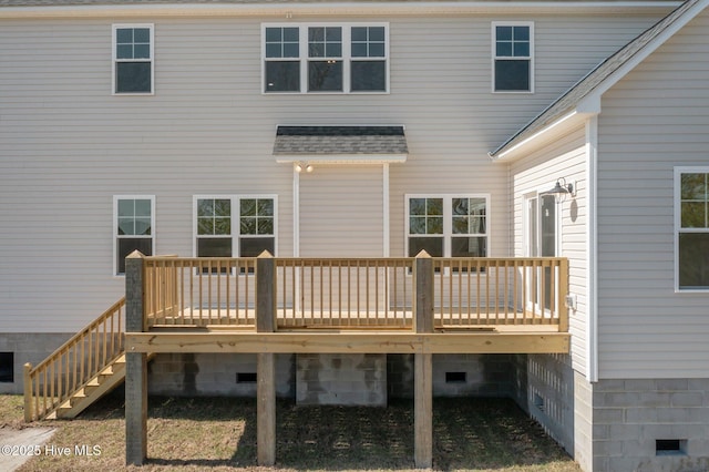 back of house with a shingled roof, a wooden deck, and crawl space