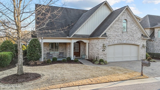 view of front of property with a garage and covered porch