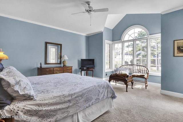 carpeted bedroom with vaulted ceiling, ornamental molding, and ceiling fan