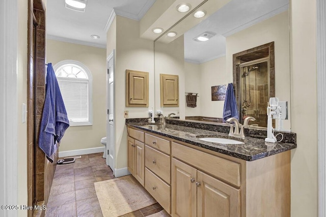 bathroom featuring ornamental molding, toilet, an enclosed shower, and vanity