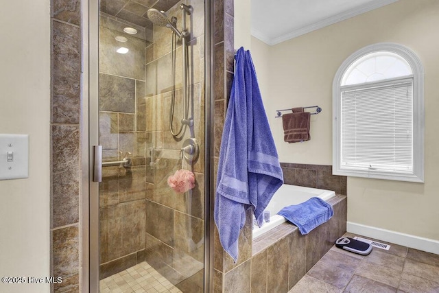 bathroom featuring crown molding, independent shower and bath, and tile patterned flooring