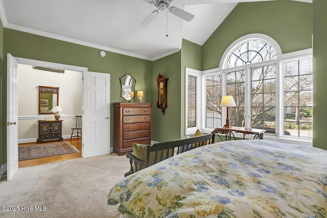 bedroom featuring crown molding, lofted ceiling, light colored carpet, and ceiling fan