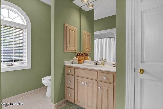 bathroom with vanity, tile patterned floors, and toilet