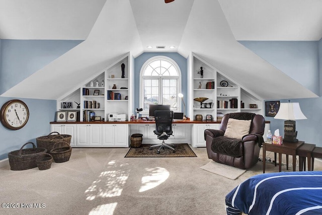 carpeted bedroom with vaulted ceiling