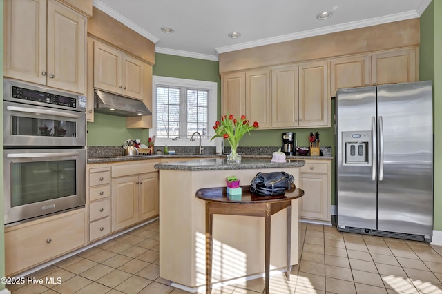 kitchen featuring light tile patterned floors, crown molding, appliances with stainless steel finishes, a center island, and a kitchen bar