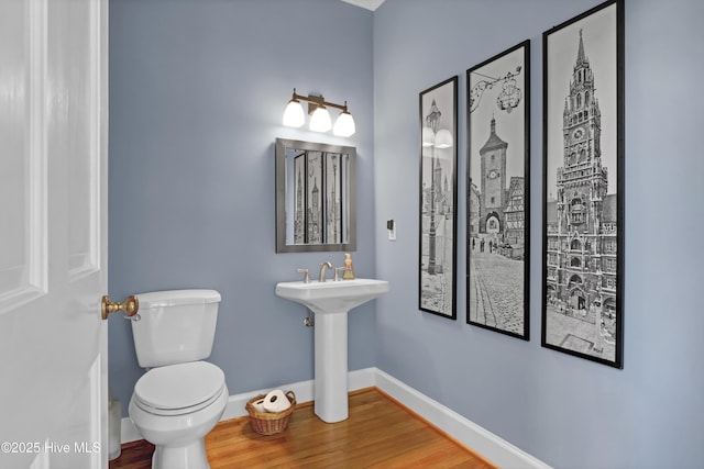 bathroom featuring toilet and hardwood / wood-style floors