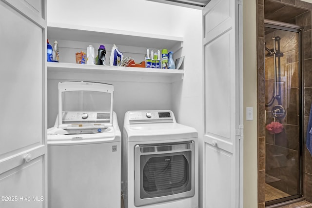 clothes washing area featuring washing machine and clothes dryer