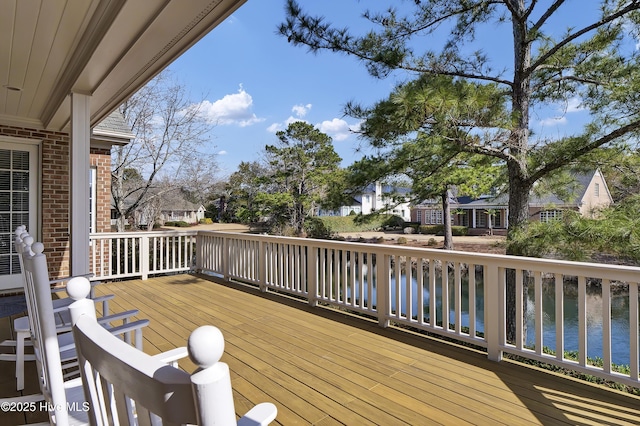 wooden terrace with a water view