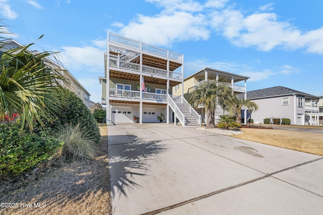 beach home featuring a garage and a balcony