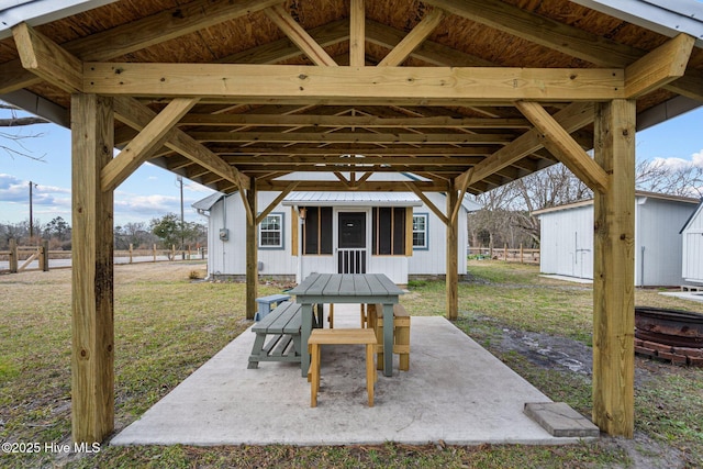 view of patio / terrace featuring a storage shed